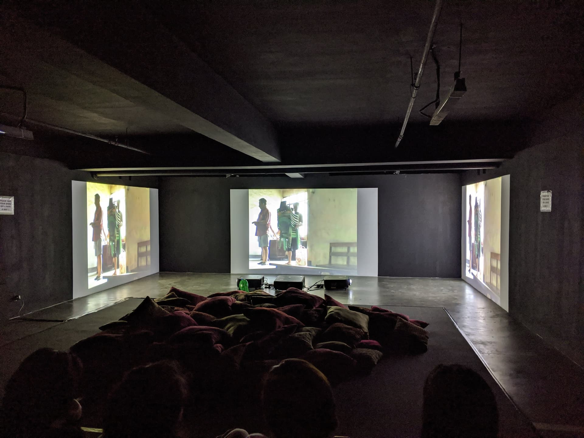 Triptych projection with film playing on three screens